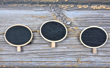 Mini blackboards chalkboards with copy space on wooden background