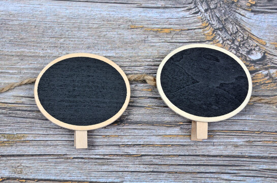 Empty chalkboard on a wooden background