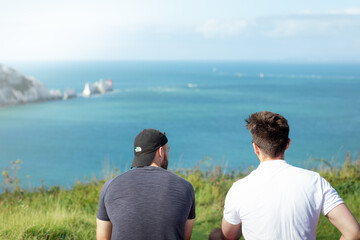 Fototapeta premium Two men hiking on a coastal path