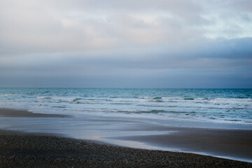 A moody blue beach scene