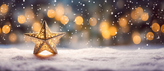 A gold star decoration on a snowy surface with a blurred lights bokeh background.  Festive and holiday-like mood.  Winter, Christmas background.