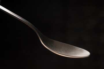 spoon on black background