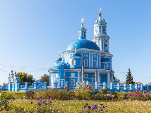 Beautiful blue Orthodox church of 1816 in honor of Kazan Icon of Mother of God in classicism style in Telma village on sunny September day