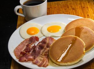breakfast with fried eggs and bacon