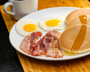 breakfast with fried eggs and bacon