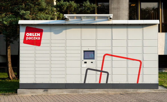 Orlen Paczka parcel machine with logo sign. Smart electronic steel parcel locker box, automatic mailboxes. Package collection machine, delivery service on September 12, 2023 in Krakow, Poland.