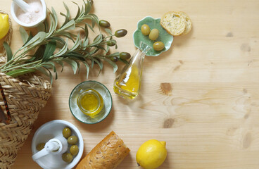 Extra Virgin Olive oil and olive fruit olive branch on the table