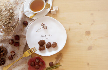 Obraz na płótnie Canvas Candied chestnut on a plate on the table