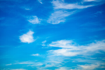 Tranquil Skies: Serene Blue Sky with Fluffy White Clouds, Nature's Beauty and Peaceful Serenity