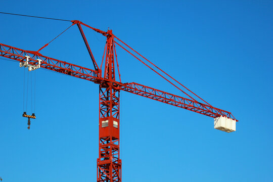 red crane over blue sky