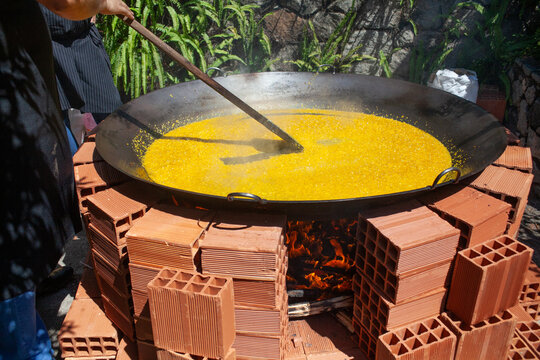 cooking in a giant frying pan