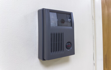 modern security camera mounted on a building, symbolizing surveillance and protection, with a sleek...