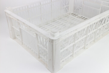 White plastic basket isolated on a white background.