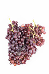 bunch of red grapes on white background - food and drink concept