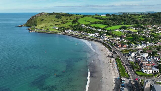 Aerial video of Ballygally Head Beach and Village on the County Antrim Coast road in Northern Ireland