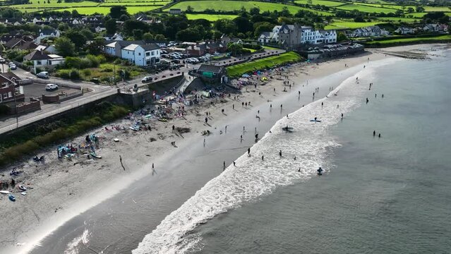 Aerial video of Ballygally Head Beach and Village on the County Antrim Coast road in Northern Ireland