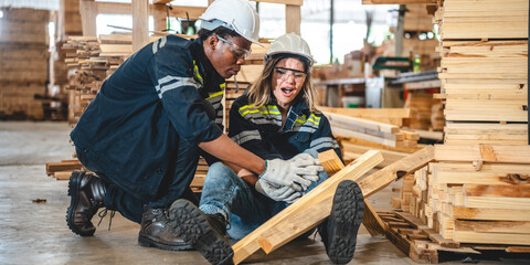 Warehouse worker man person has work related accident falls while trying to pick up wooden panel from the Shelf. colleagues call for help and medical assistance, injury and heal accident insurance
