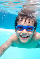 Fototapeta premium little child happy in swimming pool, school boy enjoy and smiling in underwater, kid swimming, teenage boy enjoy his life