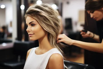 Fototapeten Blond woman at beauty salon getting haircut © lublubachka