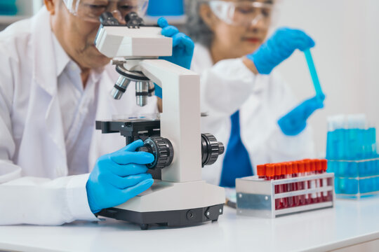 Mature physician asian man and woman people in comprehensive presentation on medical insurance, health lab test results, empowering patients with knowledge. physician expert advice on health coverage