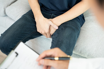 Man hold hand in front of private parts feeling discomfort and consult doctor. Venereal, testicular...