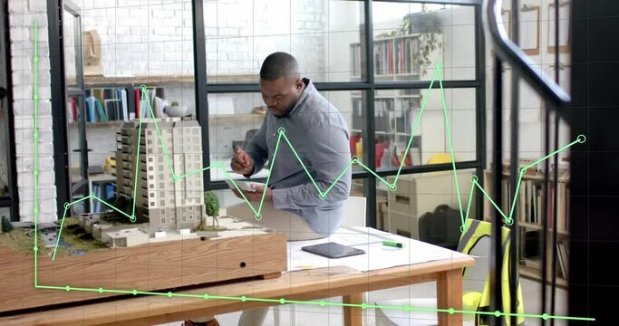 Data processing on graph over african american male architect studying building model