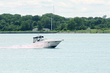 blue and white cabin cruiser on the st Clair river - 649315399