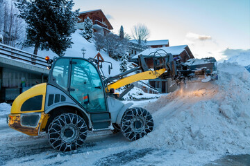 snow clearing machine in a Swiss mountain village