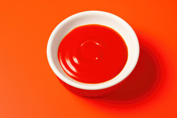 Bright Red Sauce in a Ceramic Container