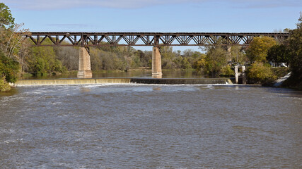 A train bridge spanning across a river