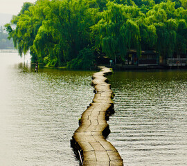 A floating path on the lake leading to a small island on the other side