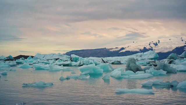 Sunset over natural iceberg in Jokulsarlon glacier lagoon at Iceland