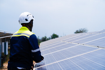 Fototapeta premium Operation and maintenance of solar power plants. professional engineers inspections and maintenance of solar power plants. Teamwork concept.