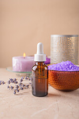 Fototapeta na wymiar Serum for face and hair care with lavender extract.