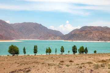 Orto Tokoi reservoir lake for irrigation and drinking water in the mountains of Kyrgyzstan