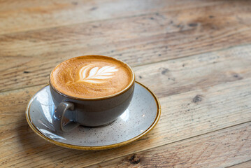 Wooden Table with Coffee Cup and Saucer