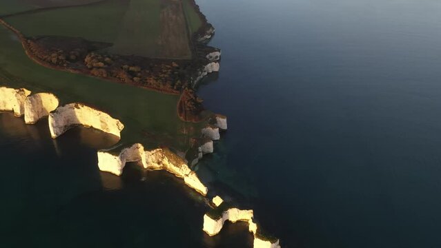 Aerial video of The Chalk Cliffs of Old Harry Rocks on the South Coast of England 