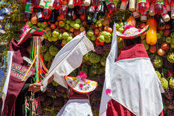 indigenous dressed with traditional clothes in front of Pukara during Pujillay festival in Tarabuco, Bolivia - obrazy, fototapety, plakaty