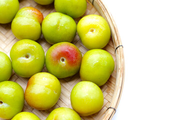 Fresh green plum fruit on white background.