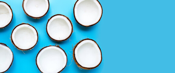 Coconut on blue background. Copy space