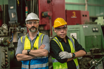 Portrait smart happy engineer adult male mixed race people worker in heavy industry standing confident team together