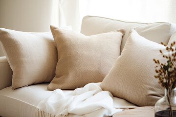 Fototapeta na wymiar Cozy boho pillows on the sofa.