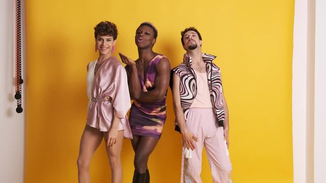 Multiethnic trans men posing in a sensual way while looking at camera