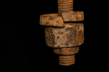 rusty nut. Rusty iron rod with screw threads. Rusted mechanical components. threaded bolt and nut isolated close up. dismantling concept, difficult to unscrew, non-removable. selective focus