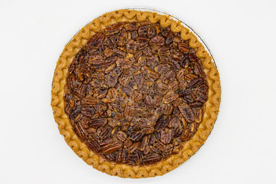 Overhead View Of A Pecan Pie On A White Background