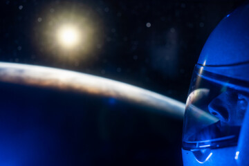 Space man astronaut greets and watching the sunrise over planet earth. 