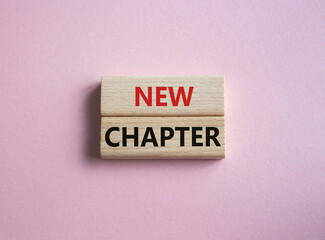 New Chapter symbol. Concept word New Chapter on wooden blocks. Beautiful pink background. Business and New Chapter concept. Copy space