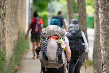 With their backpacks and caps doing the Camino de Santiago