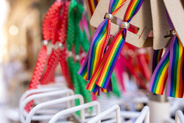 Stylish bracelets featuring both the Spanish flag and the LGBTQ+ pride flag, symbolizing unity and diversity