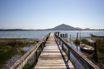 Wooden deck leading to the lagoon in Barra de Ibiraquera, Imbituba, Santa Catarina, Brazil